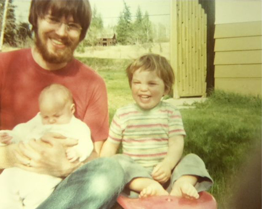 Two-year-old Jude Nathan Tomlin, baby Megan Jessica, and dad, Raymond, in June 1977