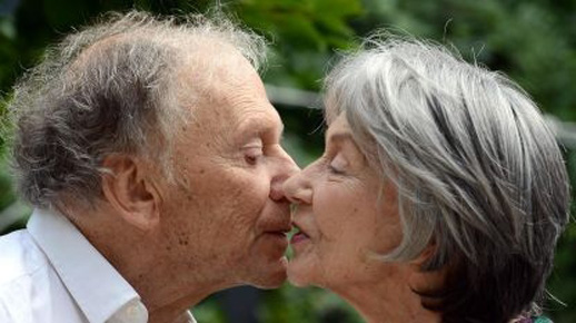 Jean-Louis Trintignant and Emmanuelle Riva exchange a kiss in Michael Haneke's Amour