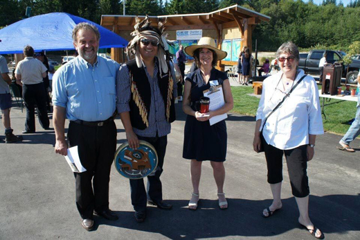 Activist and community leader Claudia Ferris (2nd from right) standing with Squamish Nation hereditary Chief Ian Campbell — currently running for the Vision Vancouver nomination for Mayor — working together to build a Visitor Information park in Gibsons, on British Columbia's Sunshine Coast.