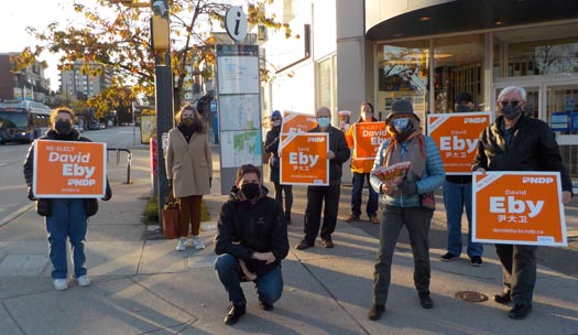 Vancouver Point Grey MLA David Eby with supporters holding signs, during the 2020 election