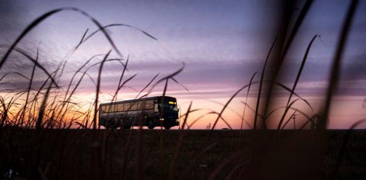 Greyhound bus, at sunrise, in a rural area of British Columbia
