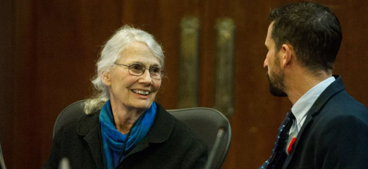 Vancouver City Councillor Jean Swanson speaking with fellow Councillor Michael Wiebe