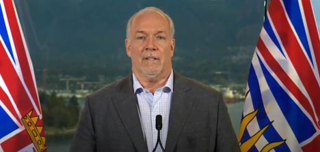 Premier John Horgan announces a delay in the $1000 payment the NDP had committed to