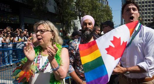 Elizabeth May, Jagmeet Singh and Justin Trudeau march in the 2019 Vancouver Pride Parade