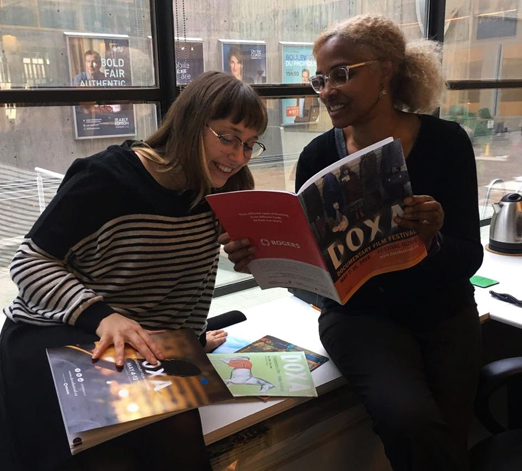 DOXA Documentary Film Festival Director of Programming Selina Crammond consulting with DOXA Operations and Volunteer Manager, Gina Garenkooper