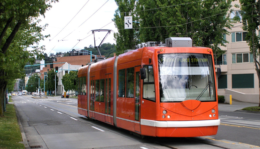 Vote for low-rise, human-scale development. And, streetcars.