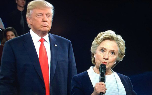 Donald Trump hovering over Hillary Clinton on the debate stage in the 2016 United States election