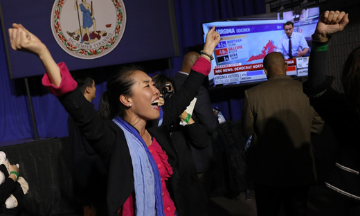 Democratic Party volunteer openingly celebrating victory on Tuesday evening
