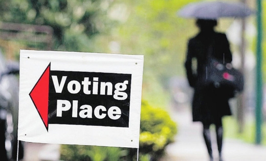 Having voted a Vancouver citizen returns home in the rain