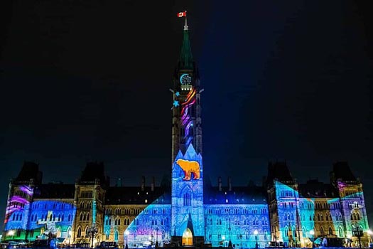 Ottawa at night, all lit up in colour